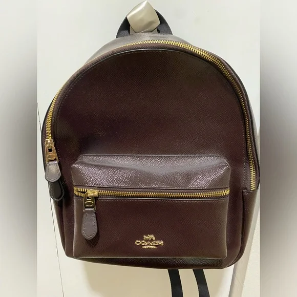coach backpack prices Court In Signature Canvas Printed coated canvas and refined pebble leather Inside zip and multifunction pockets Double zip closure fabric lining Handle with 1 1/2 drop Outside zip and open pockets Adjustable shoulder straps 7 3/4 (L) x 8 3/4 (H) x 3 1/2 (W) Print may vary slightly from what is pictured Style No Coach C8183 Men's Hudson Backpack